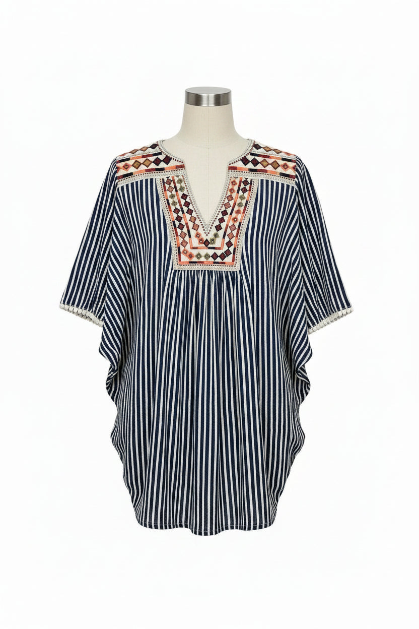A women's short-sleeve top with vertical navy and white stripes, featuring a V-neckline with colorful geometric embroidery in red, orange, and green, and a cream-colored collar.