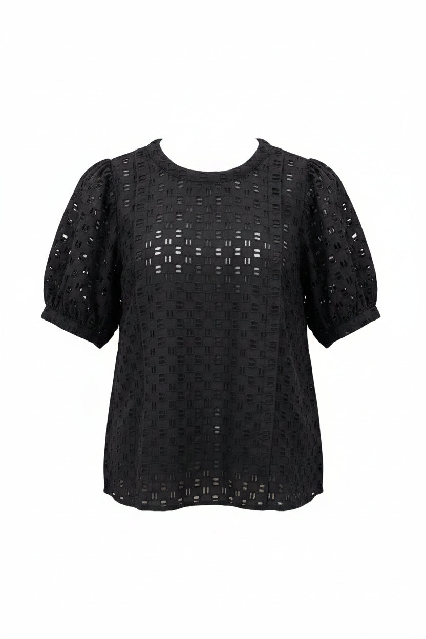 A black short-sleeve blouse with a textured geometric eyelet pattern and sheer puff sleeves. 